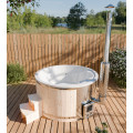 Fiberglass hot tub with integrated heater